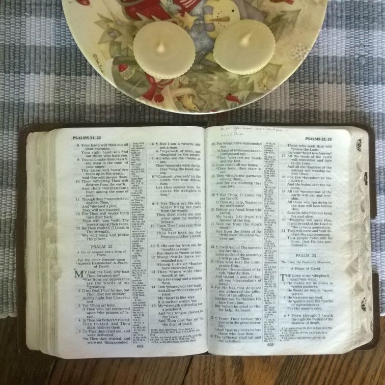 Bible opened to Psalm 22 with Justin's organic white chocolate peanut butter cups